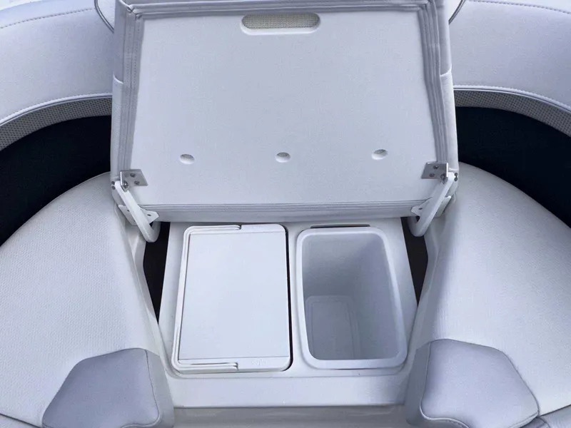 Slide: The Image of 2025 Formula 350 Crossover Bowrider I/O storage compartment with open lid. - 36