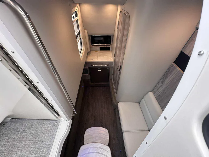 Slide: The Image of Interior of 2025 Formula 350 Crossover Bowrider I/O, featuring modern seating and kitchenette. - 38