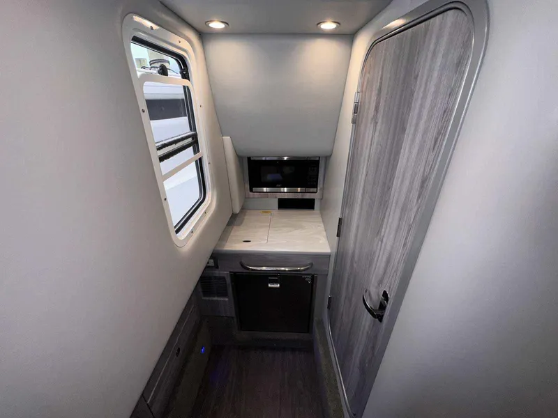 Slide: The Image of Interior of 2025 Formula 350 Crossover Bowrider I/O, featuring modern kitchenette and sleek design. - 39