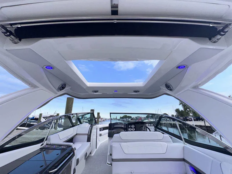 Slide: The Image of 2025 Formula 350 Crossover Bowrider I/O interior with open sunroof and modern seating. - 4