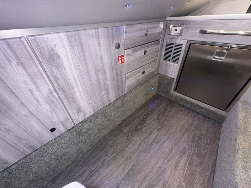 Slide: The Image of Interior of 2025 Formula 350 Crossover Bowrider I/O with modern cabinetry and flooring. - 40