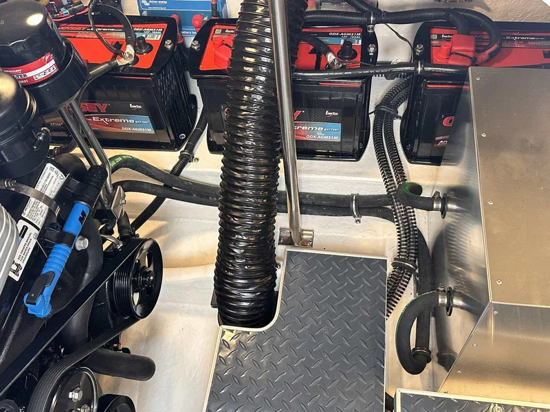 Slide: The Image of Engine compartment of 2025 Formula 350 Crossover Bowrider I/O with batteries and wiring. - 41