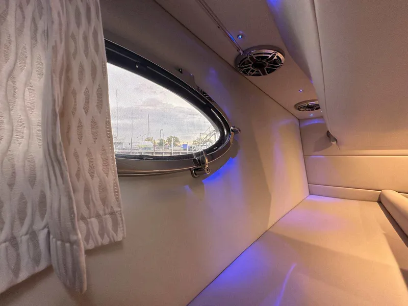 Slide: The Image of Interior cabin of 2025 Formula 350 Crossover Bowrider I/O with window and ambient lighting. - 44