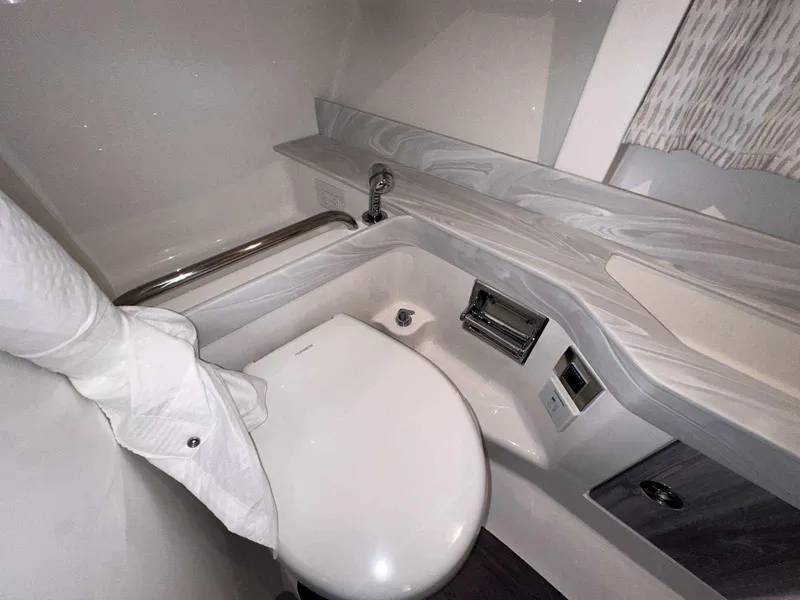 Slide: The Image of 2025 Formula 350 Crossover Bowrider I/O bathroom with modern fixtures and sleek design. - 48