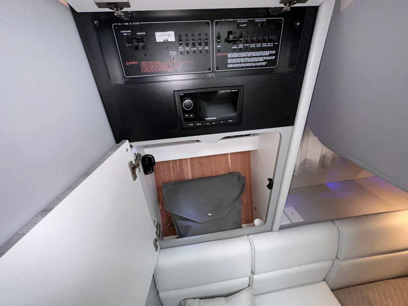 Slide: The Image of 2025 Formula 350 Crossover Bowrider I/O interior control panel and storage compartment. - 49