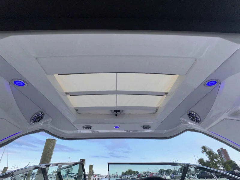 Slide: The Image of 2025 Formula 350 Crossover Bowrider I/O interior with sunroof and blue LED lights. - 5