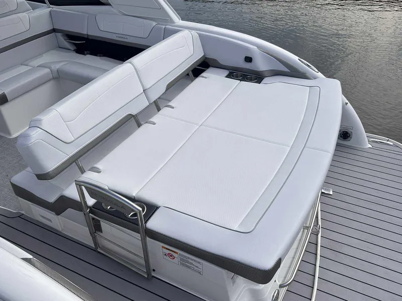 Slide: The Image of 2025 Formula 350 Crossover Bowrider I/O with spacious white seating on deck. - 6