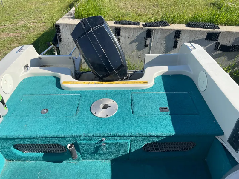 Slide: The Image of 1996 Sylvan VIPER boat cockpit with steering wheel, gauges, and controls. - 11