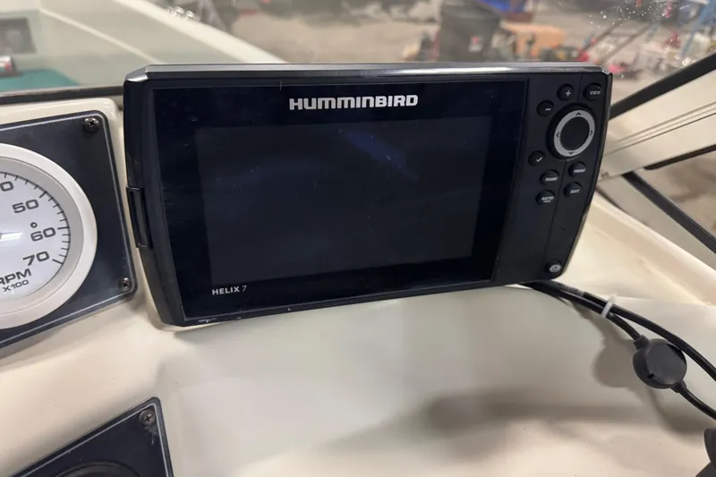 Slide: The Image of Humminbird Helix 7 fish finder on 1996 Sylvan VIPER boat dashboard. - 13