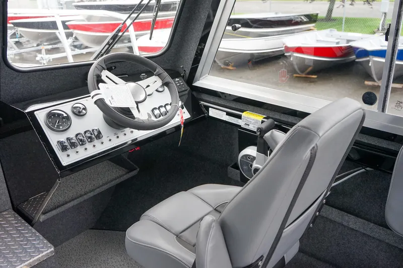 Slide: The Image of Interior cockpit of 2024 Thunder Jet 21 Chinook Pro boat with steering wheel and control panel. - 11