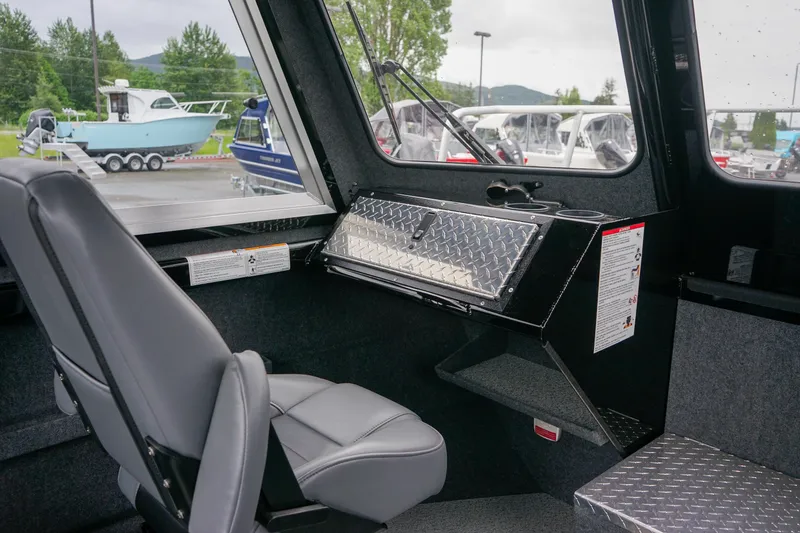 Slide: The Image of 2024 Thunder Jet 21 Chinook Pro boat interior with seating and dashboard. - 13