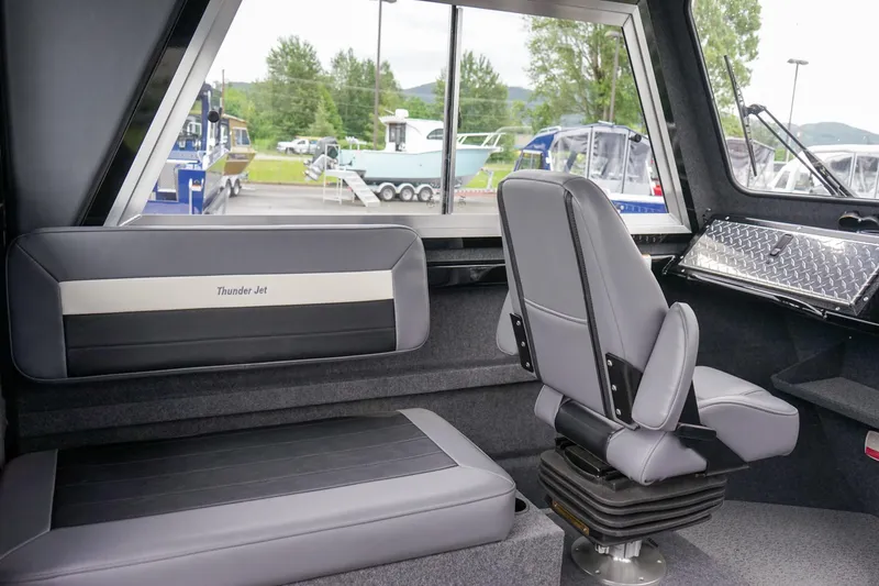 Slide: The Image of Interior of 2024 Thunder Jet 21 Chinook Pro boat with seating and windows. - 14