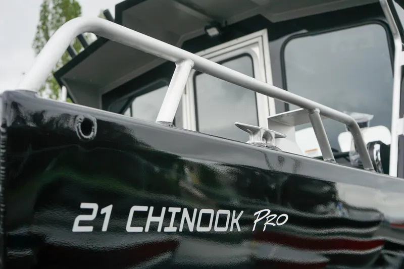 Slide: The Image of 2024 Thunder Jet 21 Chinook Pro boat close-up, showcasing sleek design and branding. - 17