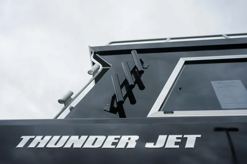 Slide: The Image of Close-up of 2024 Thunder Jet 21 Chinook Pro boat exterior with logo. - 19
