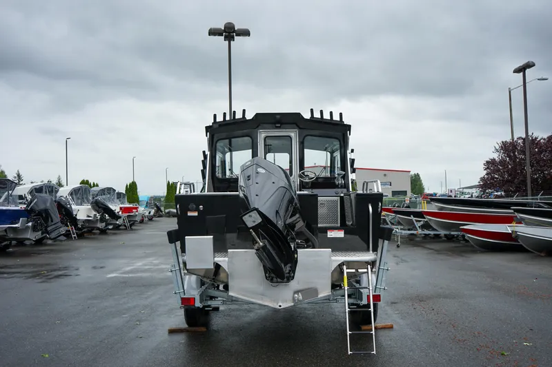 Slide: The Image of 2024 Thunder Jet 21 Chinook Pro boat rear view in a marina. - 4