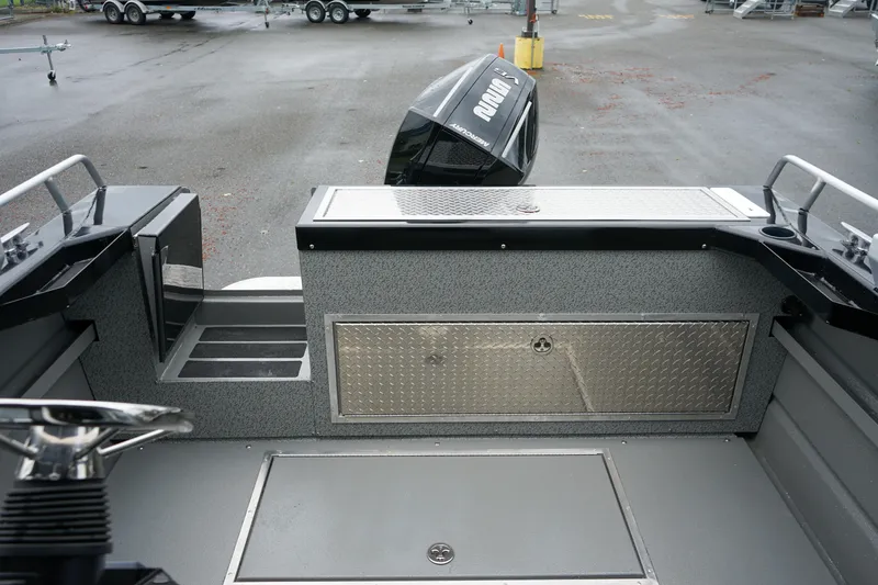 Slide: The Image of 2024 Thunder Jet 21 Chinook Pro boat interior with storage compartments and outboard motor. - 5