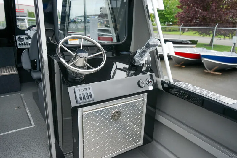 Slide: The Image of 2024 Thunder Jet 21 Chinook Pro boat interior with steering wheel and control panel. - 7