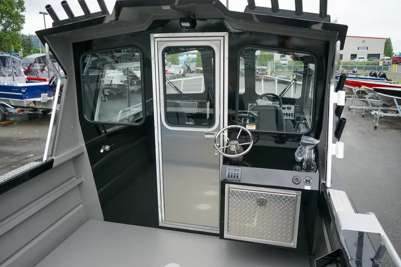 Slide: The Image of 2024 Thunder Jet 21 Chinook Pro boat interior with steering wheel and control panel. - 8