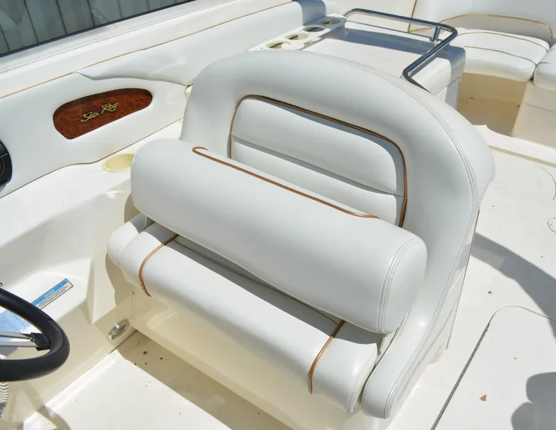 Slide: The Image of 1997 Sea Ray 280 Cuddy Cabin boat interior with white leather seating. - 13