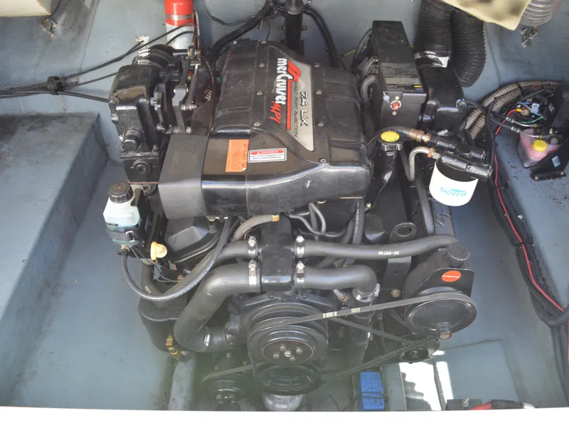 Slide: The Image of 1997 Sea Ray 280 Cuddy Cabin engine compartment with MerCruiser engine. - 17