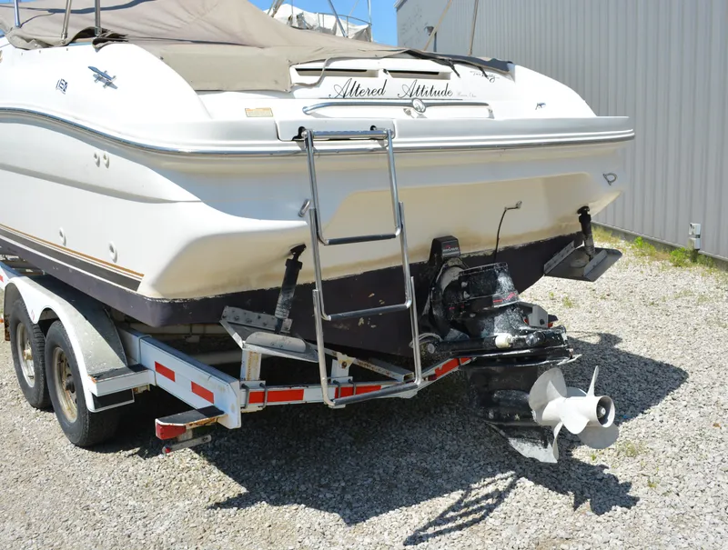 Slide: The Image of 1997 Sea Ray 280 Cuddy Cabin boat on trailer, rear view with outboard motor. - 3