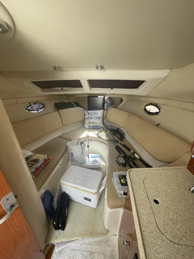 Slide: The Image of Interior of 2009 Regal 2565 Window Express boat with seating and storage. - 12