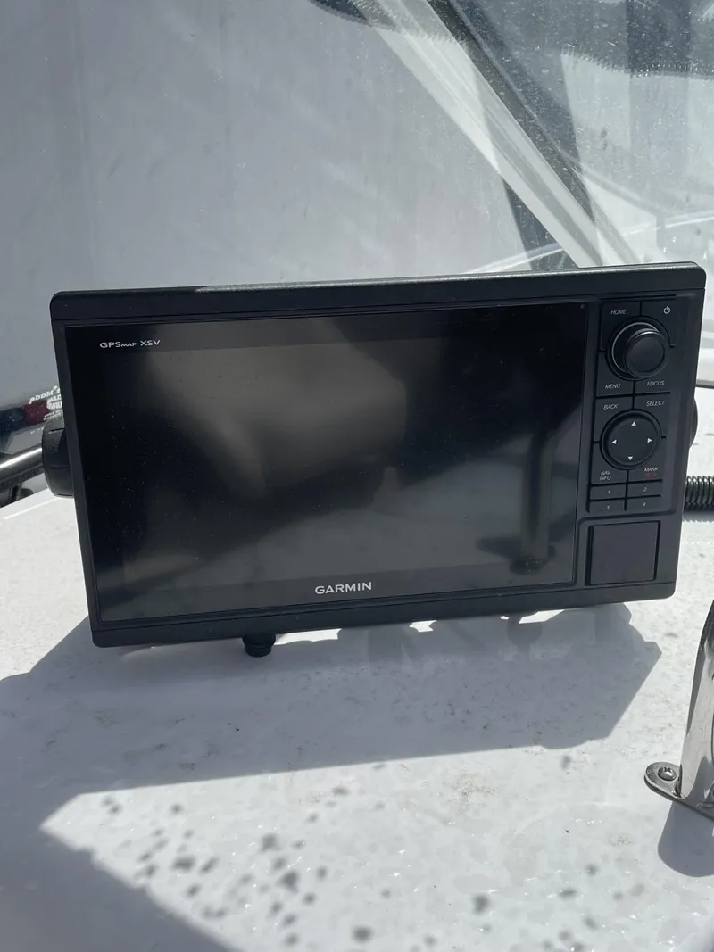 Slide: The Image of Garmin marine GPS device on 2009 Regal 2565 Window Express boat dashboard. - 6