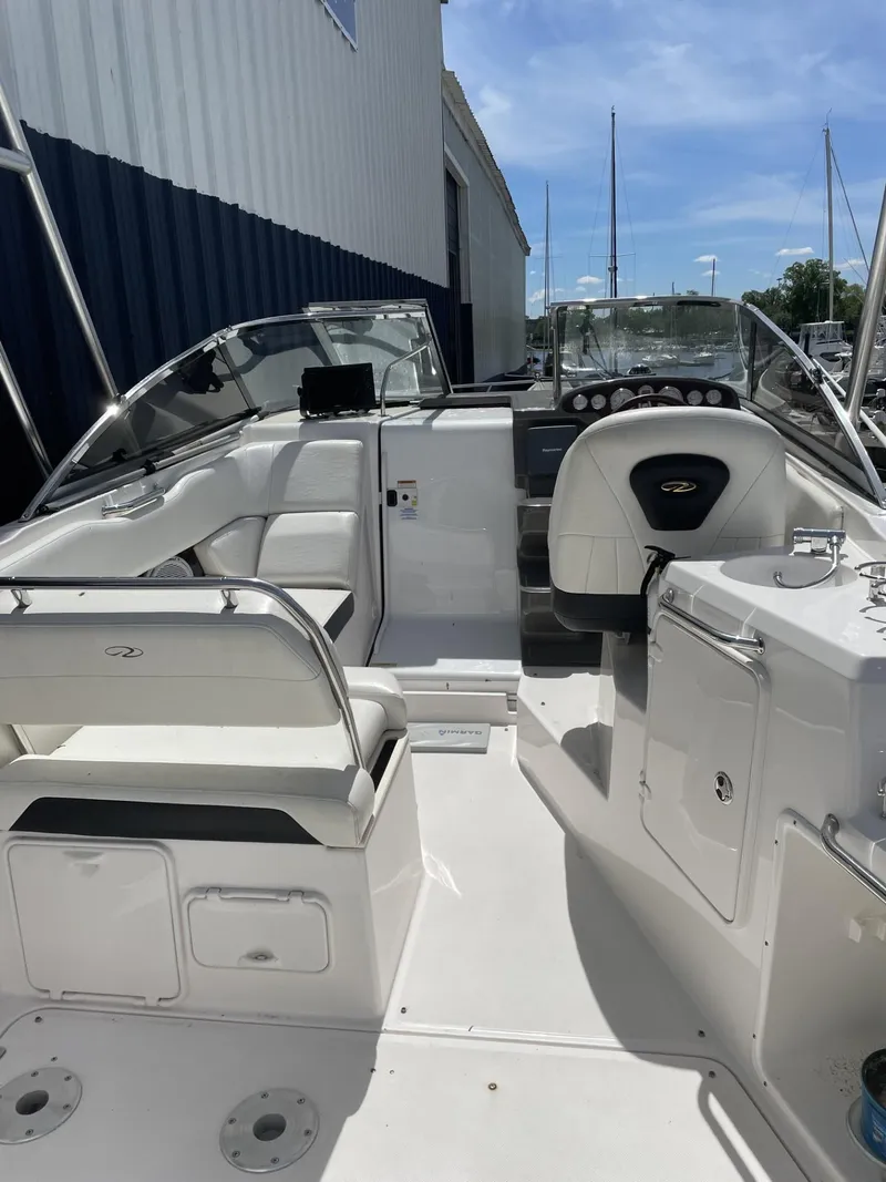 Slide: The Image of 2009 Regal 2565 Window Express boat interior with seating and control panel. - 7