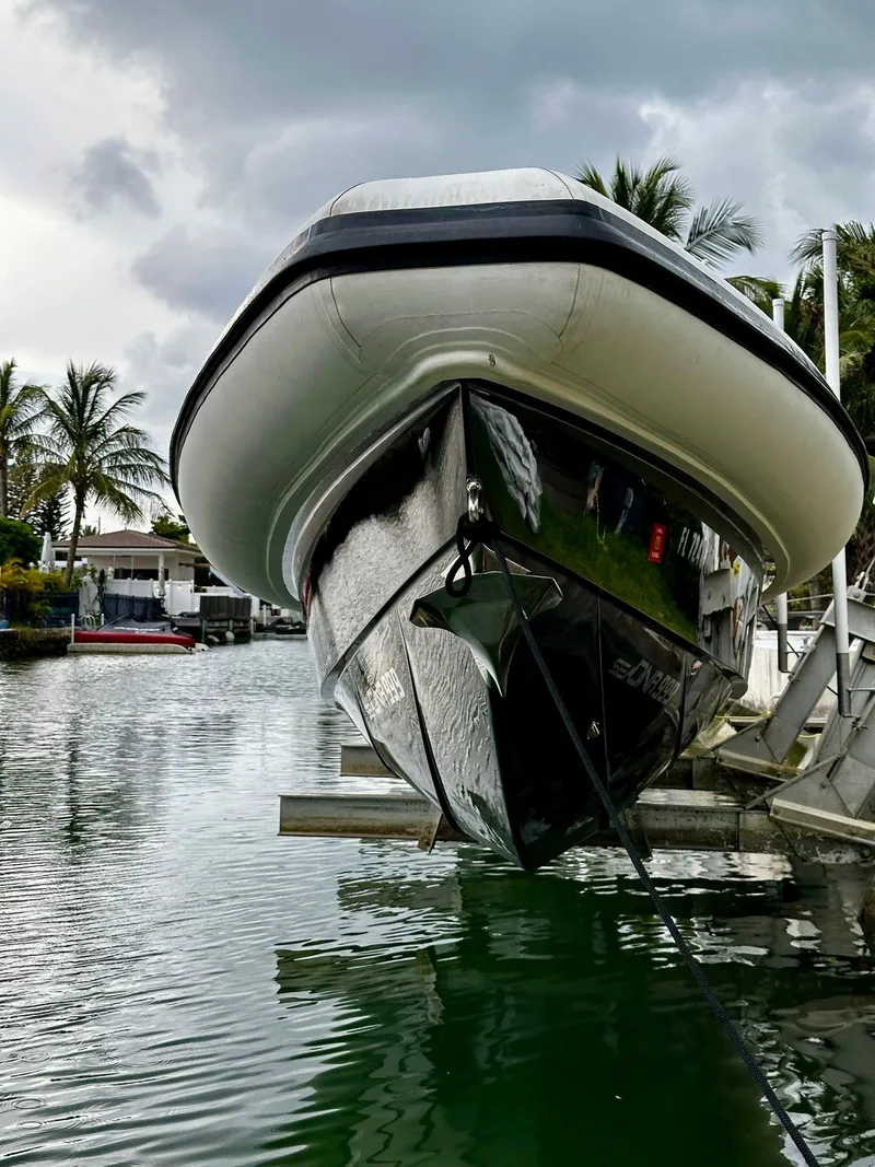 Slide: The Image of 2020 Technohull seaDNA 999 boat docked in a marina. - 10