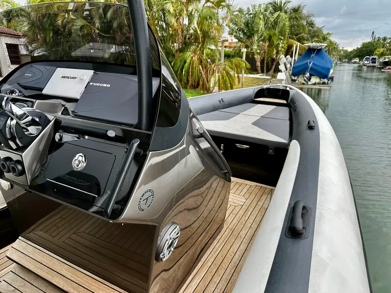 Slide: The Image of 2020 Technohull seaDNA 999 boat with sleek design docked by a canal. - 11