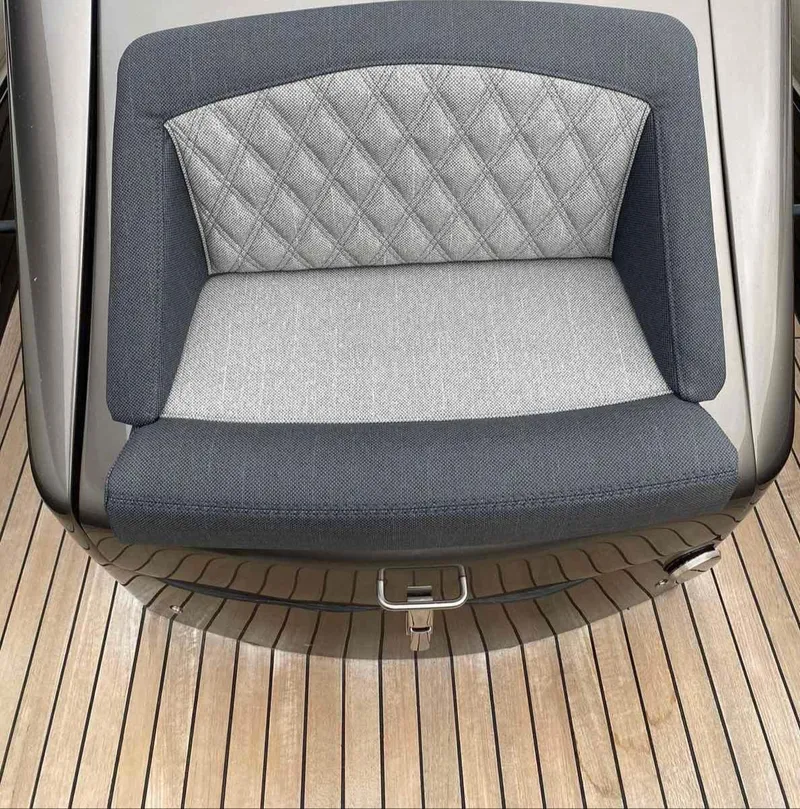 Slide: The Image of Technohull seaDNA 999 2020 boat seat with quilted upholstery on teak deck. - 13
