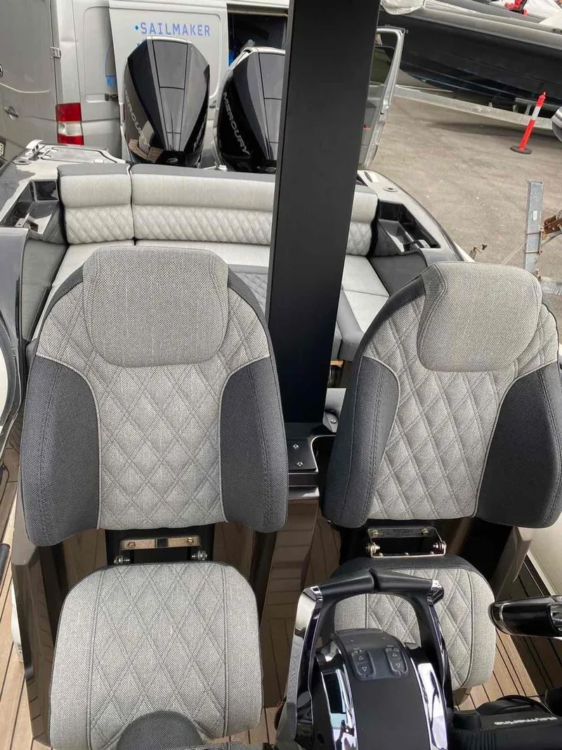 Slide: The Image of 2020 Technohull seaDNA 999 boat interior with dual seats and control console. - 14
