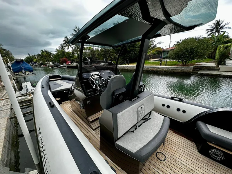 Slide: The Image of 2020 Technohull seaDNA 999 boat docked in a scenic canal. - 22