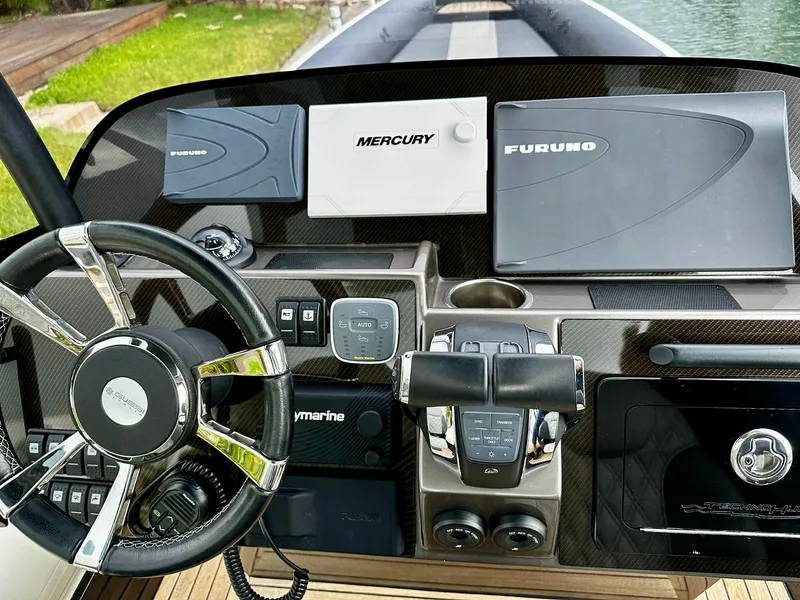 Slide: The Image of 2020 Technohull seaDNA 999 dashboard with Mercury and Furuno navigation systems. - 23