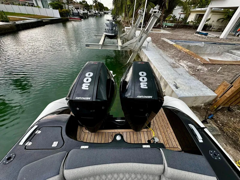 Slide: The Image of 2020 Technohull seaDNA 999 with twin 300 Mercury outboard engines docked in a canal. - 26