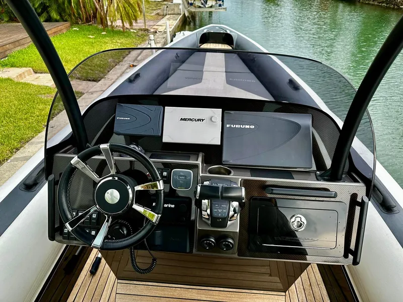 Slide: The Image of 2020 Technohull seaDNA 999 boat dashboard with modern navigation and control systems. - 6