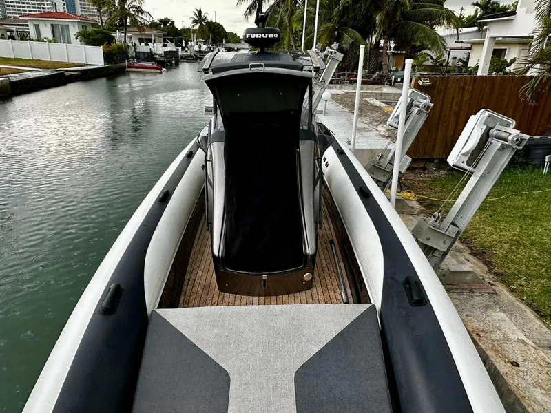 Slide: The Image of 2020 Technohull seaDNA 999 boat docked by a canal. - 9