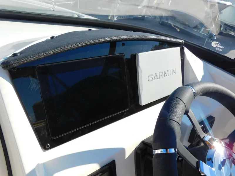 Slide: The Image of 2024 Stingray 211 DC boat dashboard with Garmin navigation system. - 10
