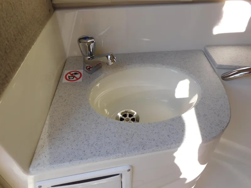 Slide: The Image of 2024 Stingray 211 DC boat sink with faucet and countertop - 19
