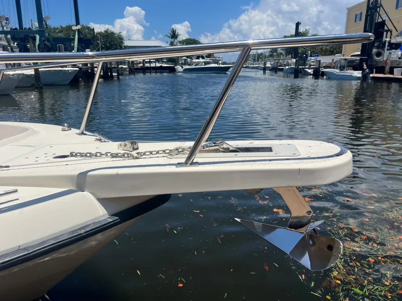 Slide: The Image of 1996 Pursuit 2470 CC boat with anchor at marina. - 8