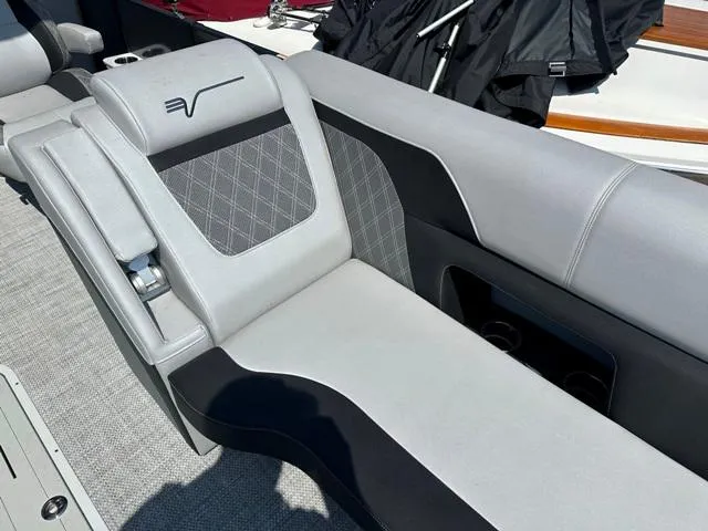 Slide: The Image of 2024 Vanderbilt 700 T boat interior with gray and black seating. - 13