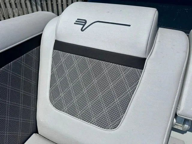 Slide: The Image of Vanderbilt 700 T 2024 model seat with diamond-stitched upholstery and logo. - 15