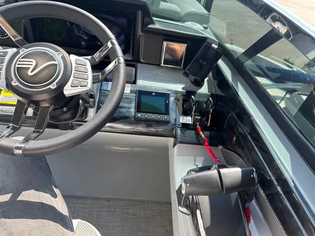 Slide: The Image of 2024 Vanderbilt 700 T boat cockpit with steering wheel and control panel - 20