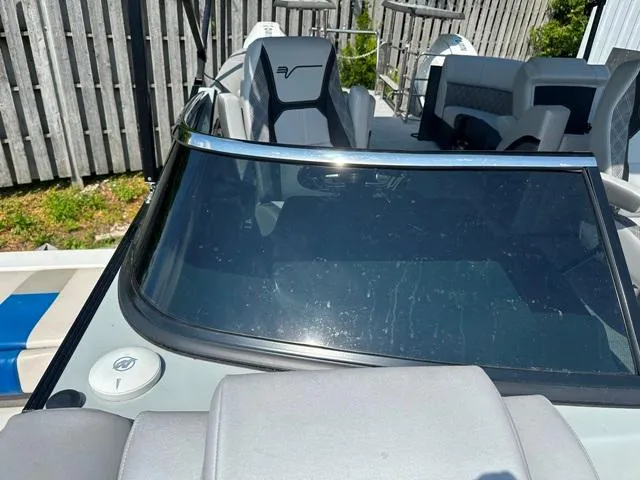 Slide: The Image of 2024 Vanderbilt 700 T boat with sleek windshield and modern seating. - 23