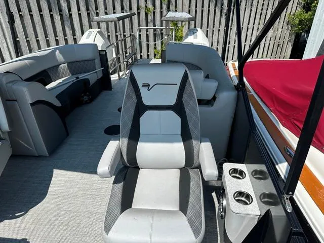 Slide: The Image of 2024 Vanderbilt 700 T boat interior with grey seating and cup holders. - 24