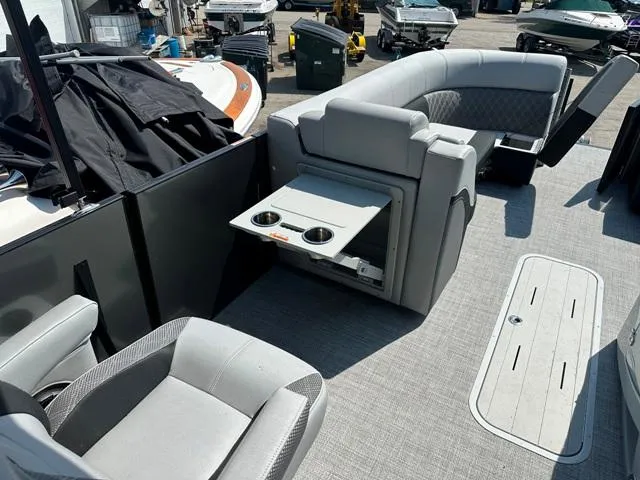 Slide: The Image of 2024 Vanderbilt 700 T boat interior with seating and fold-out table. - 25