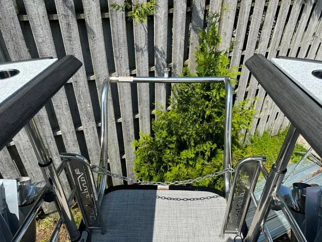 Slide: The Image of 2024 Vanderbilt 700 T boat boarding platform with safety chain and railing. - 32