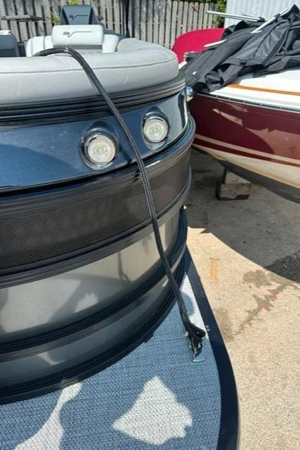 Slide: The Image of 2024 Vanderbilt 700 T boat docked with a black rope. - 4