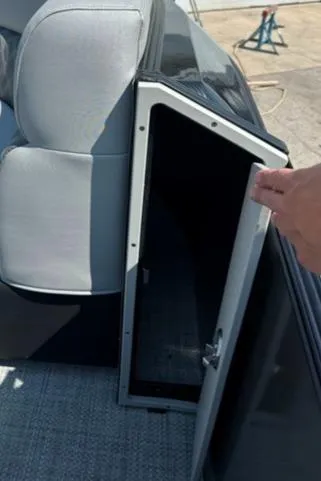 Slide: The Image of 2024 Vanderbilt 700 T boat storage compartment with open door. - 6