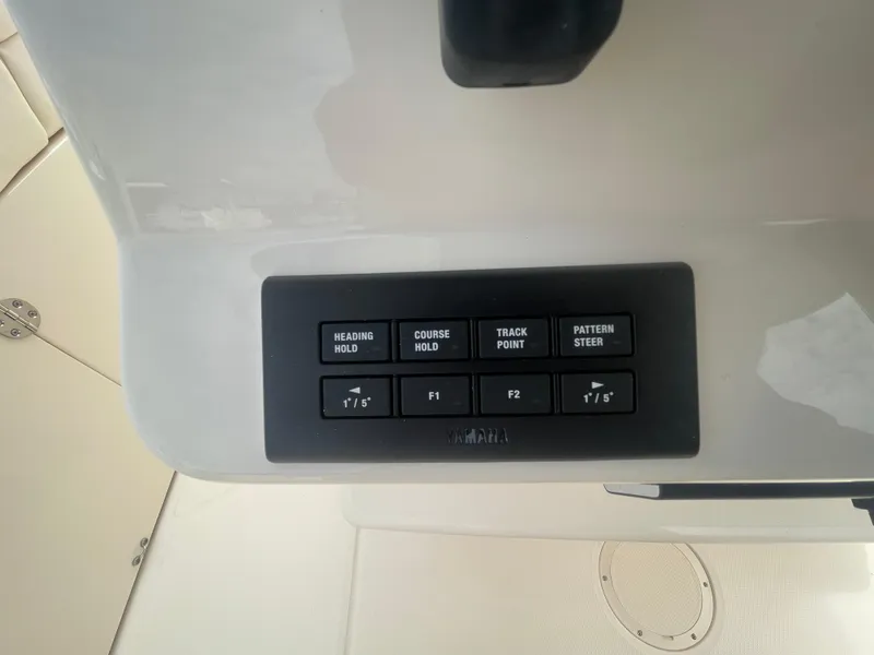 Slide: The Image of Control panel of a 2025 Grady-White Canyon 271 boat with navigation buttons. - 14